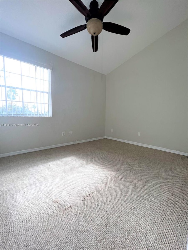 spare room featuring ceiling fan and carpet floors