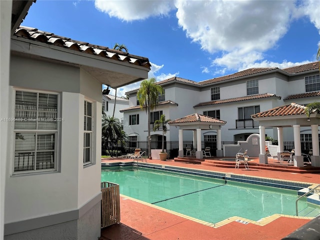 view of swimming pool with a patio area