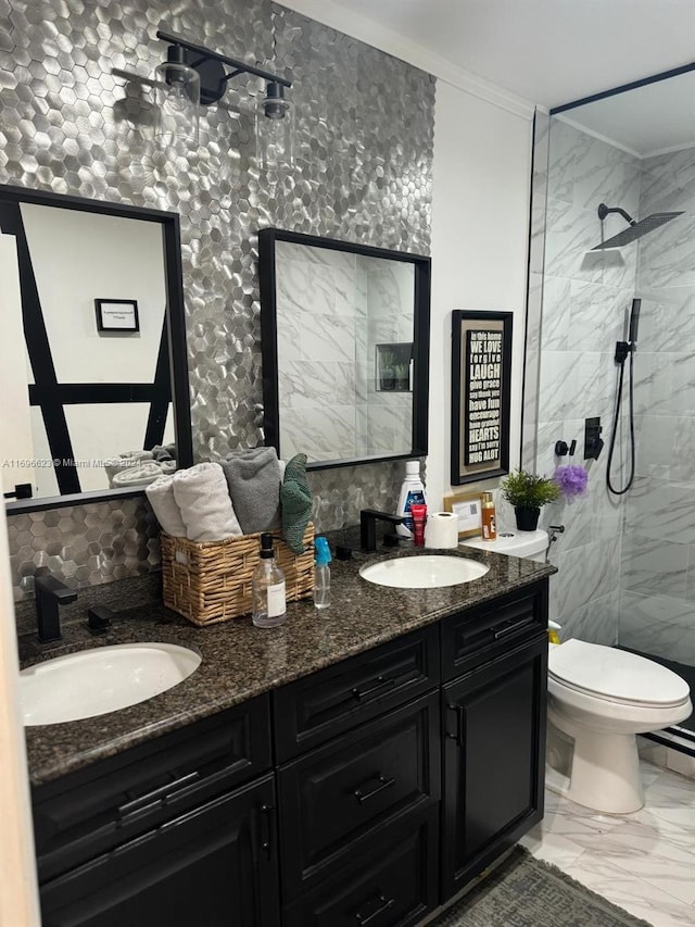 bathroom featuring vanity, toilet, a tile shower, and tile walls