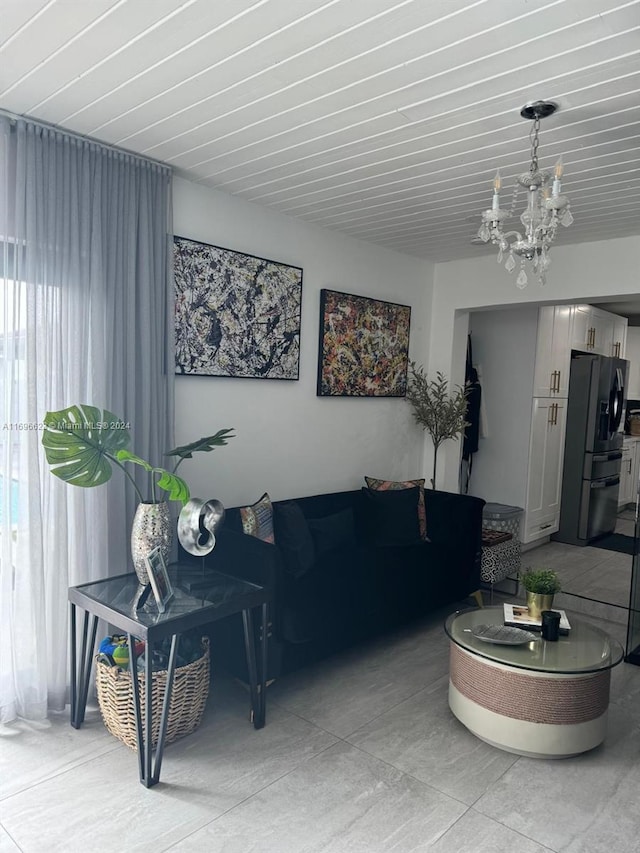 living room featuring a notable chandelier