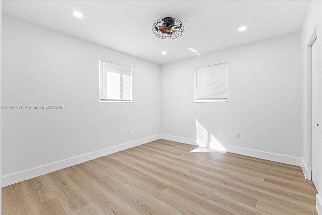 unfurnished room featuring light hardwood / wood-style flooring