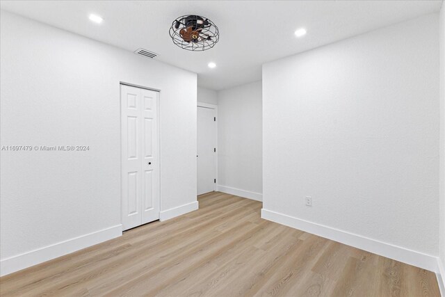 unfurnished room featuring light hardwood / wood-style floors