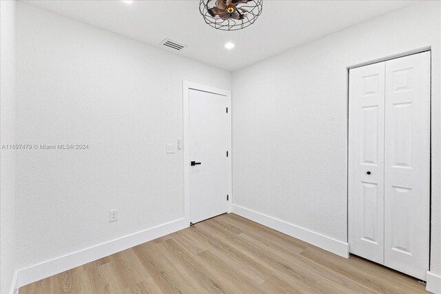 unfurnished room with light wood-type flooring