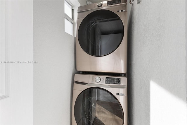 washroom with stacked washer and clothes dryer