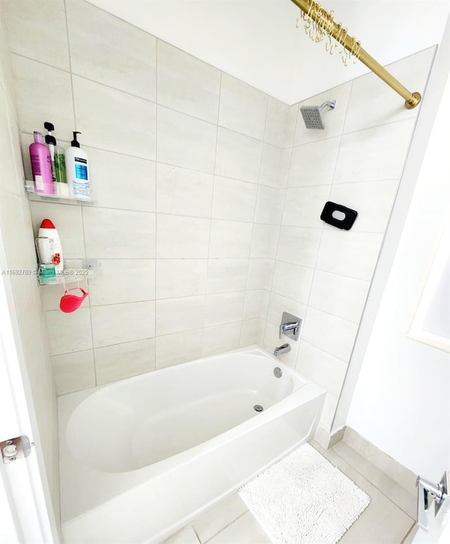 bathroom featuring washtub / shower combination and tile patterned floors