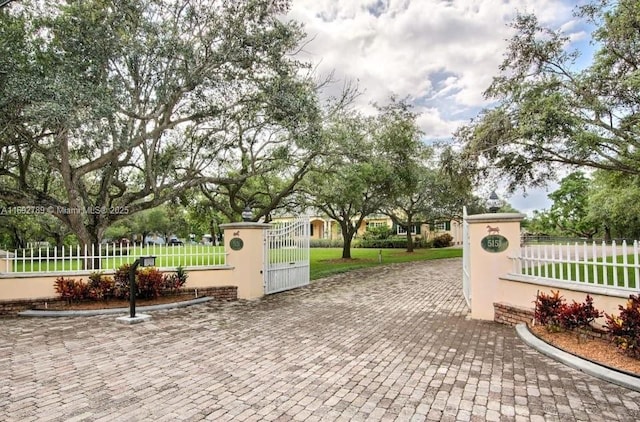 view of gate featuring a fenced front yard