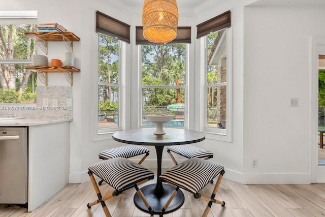 dining area featuring a healthy amount of sunlight and light hardwood / wood-style floors