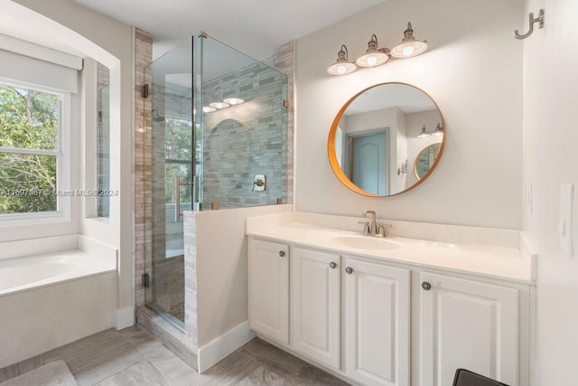 bathroom featuring vanity and plus walk in shower