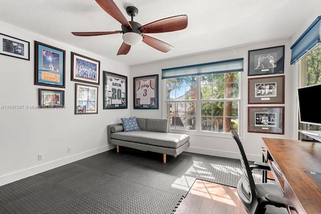 office with a textured ceiling and ceiling fan