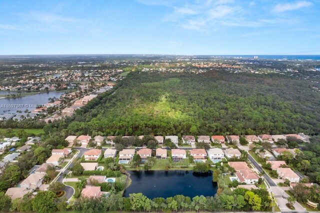 birds eye view of property with a water view