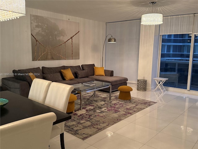 living room featuring light tile patterned floors and an inviting chandelier