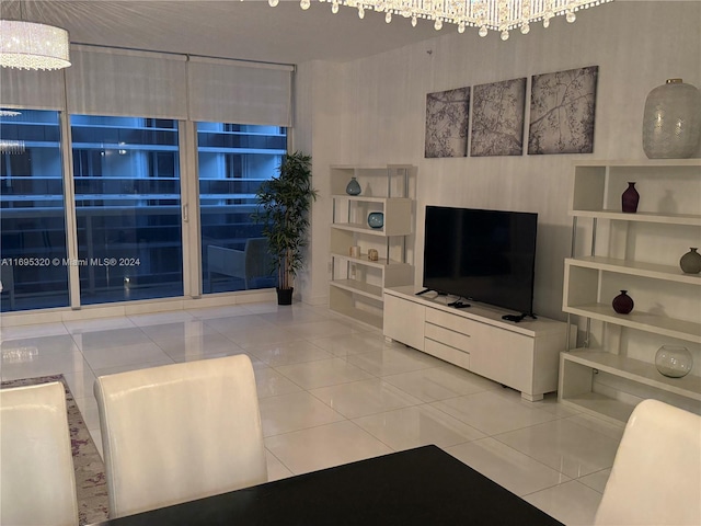 living room with tile patterned flooring and an inviting chandelier