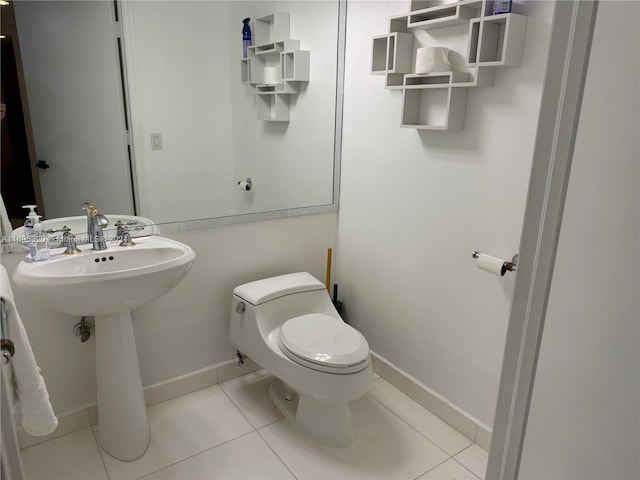 bathroom featuring tile patterned flooring and toilet