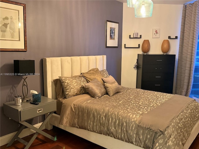 bedroom featuring dark hardwood / wood-style flooring