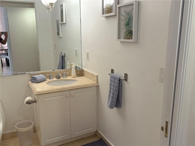 bathroom with tile patterned flooring and vanity