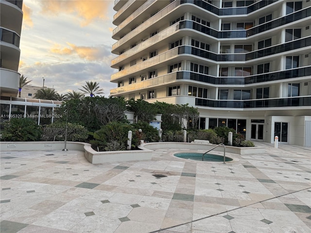 view of outdoor building at dusk