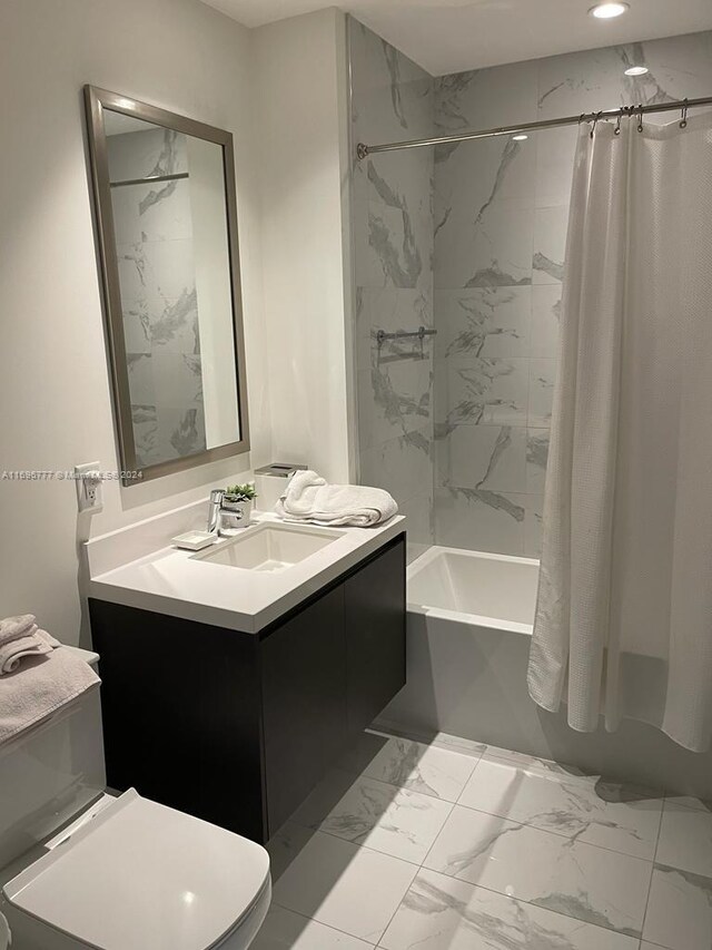 full bathroom with vanity, toilet, and shower / tub combo with curtain