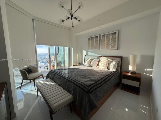 bedroom with access to exterior, light tile patterned floors, and a chandelier