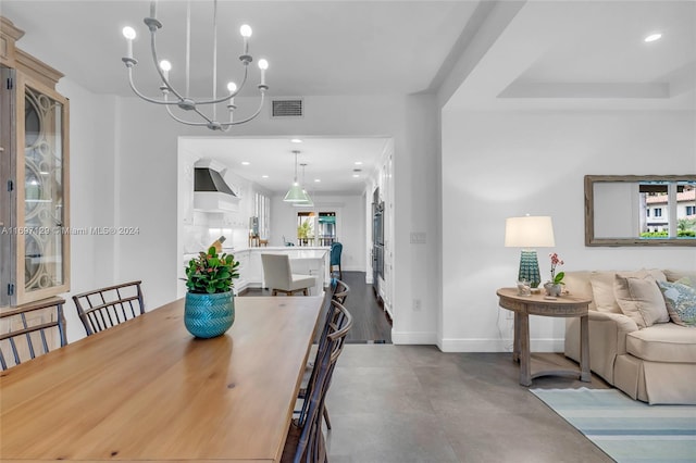 dining area featuring an inviting chandelier