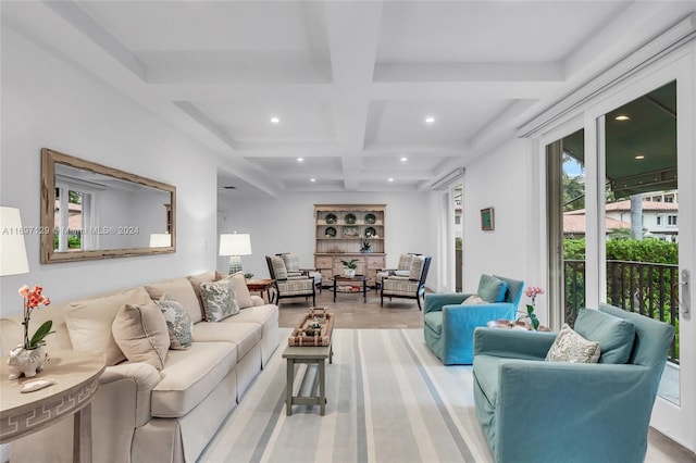 living room with beam ceiling, light wood-type flooring, and coffered ceiling