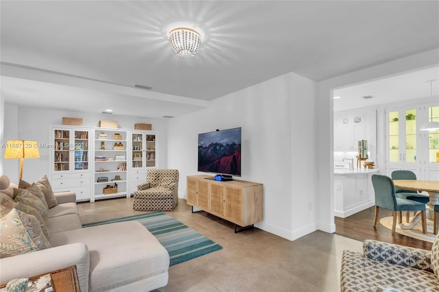 living room featuring an inviting chandelier