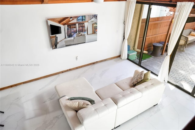 living room featuring vaulted ceiling and ceiling fan