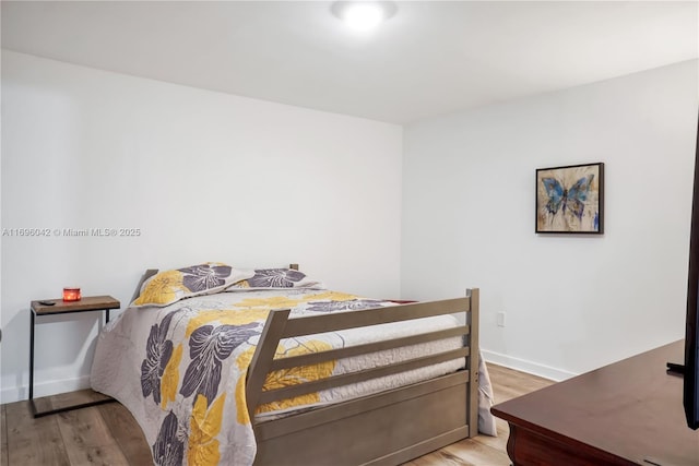 bedroom featuring hardwood / wood-style flooring