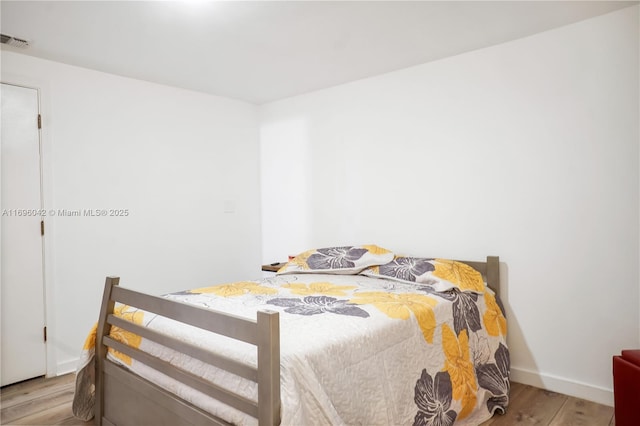 bedroom with light wood-type flooring