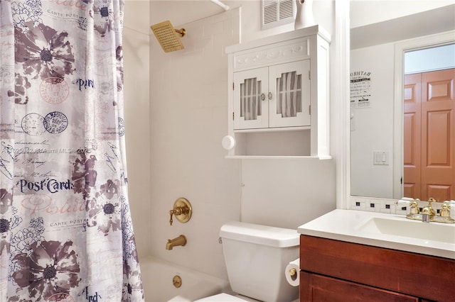 full bathroom with vanity, toilet, decorative backsplash, and shower / bath combo