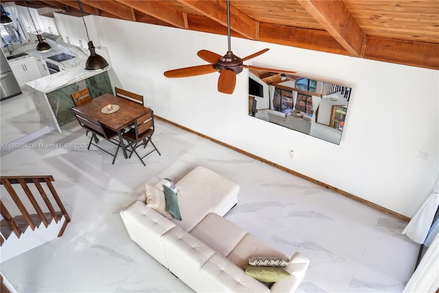 dining space featuring beamed ceiling, ceiling fan, and wood ceiling