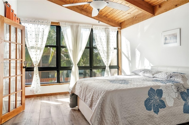 bedroom featuring multiple windows, ceiling fan, light hardwood / wood-style flooring, and wood ceiling