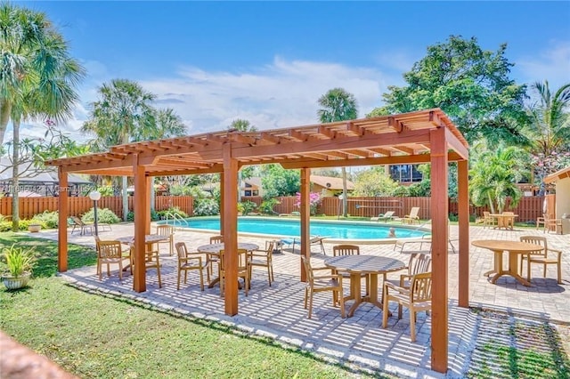 view of patio / terrace featuring a pergola and a fenced in pool