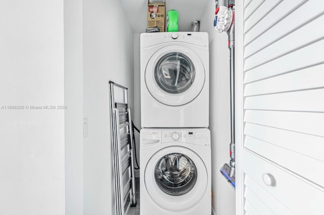 washroom with stacked washer and dryer