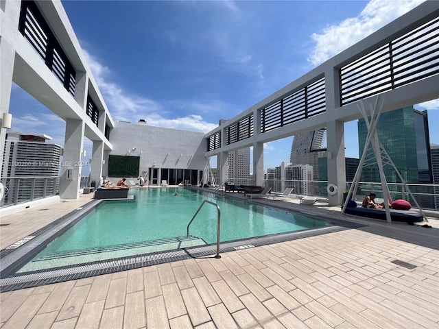 view of swimming pool with a patio