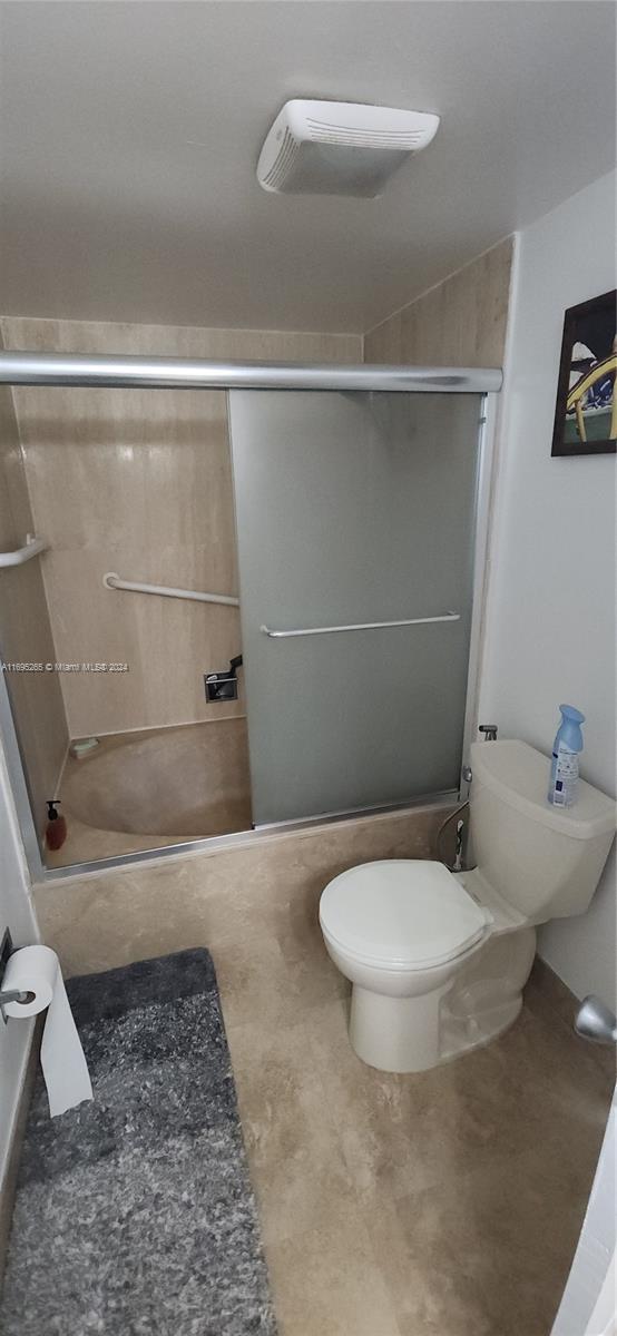 1201 S Ocean Dr Unit 304S, Hollywood, FL 33019 - full bathroom with toilet and bath / shower combo with glass door