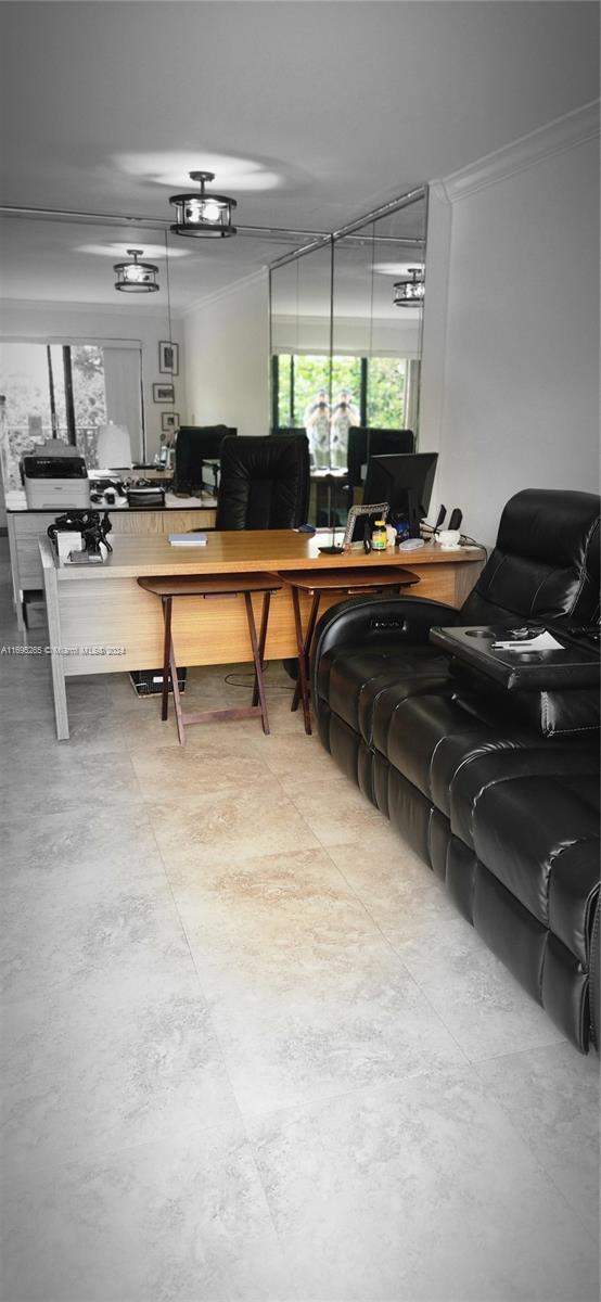 1201 S Ocean Dr Unit 304S, Hollywood, FL 33019 - living area featuring an office area, concrete floors, and ornamental molding