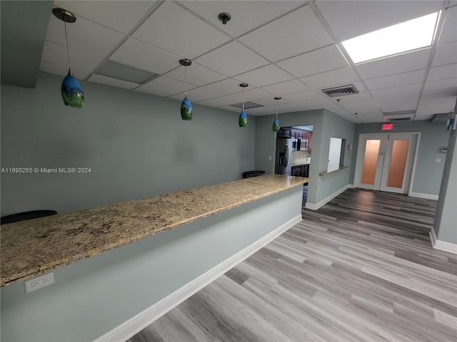 1201 S Ocean Dr Unit 304S, Hollywood, FL 33019 - unfurnished room with wood finished floors, a drop ceiling, and a pendent fire sprinkler