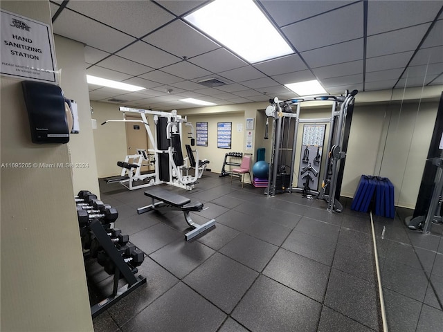 workout area with a drop ceiling