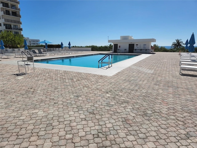 view of swimming pool featuring a patio