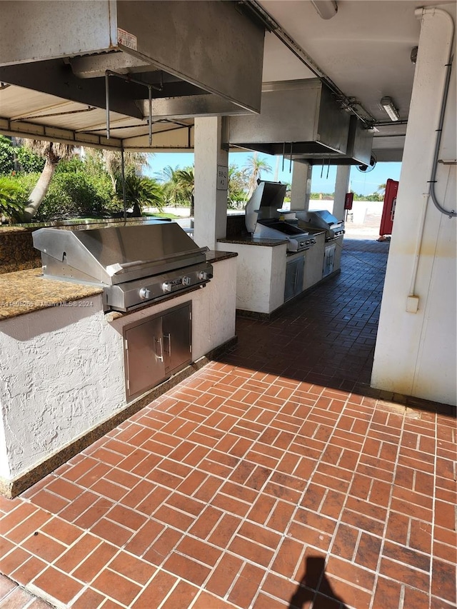 1201 S Ocean Dr Unit 304S, Hollywood, FL 33019 - view of patio / terrace featuring an outdoor kitchen