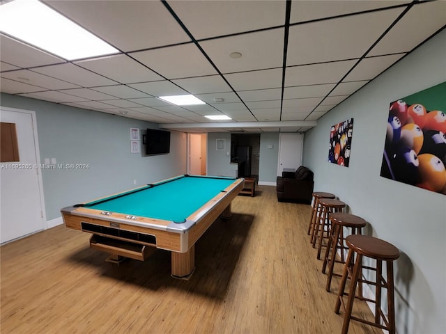 recreation room with a paneled ceiling, light hardwood / wood-style floors, and pool table