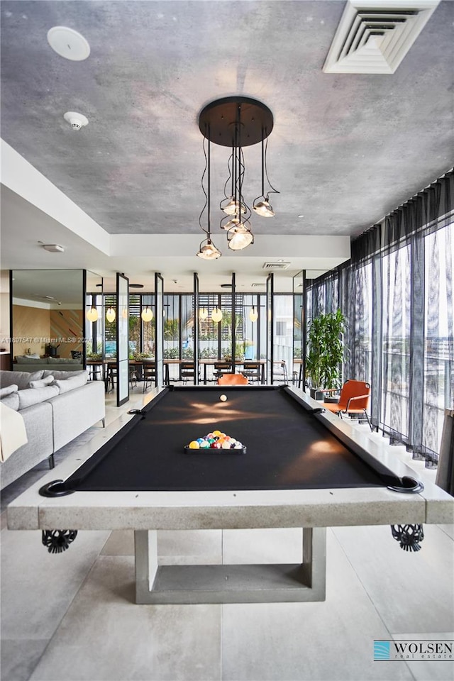 game room featuring a wealth of natural light and billiards