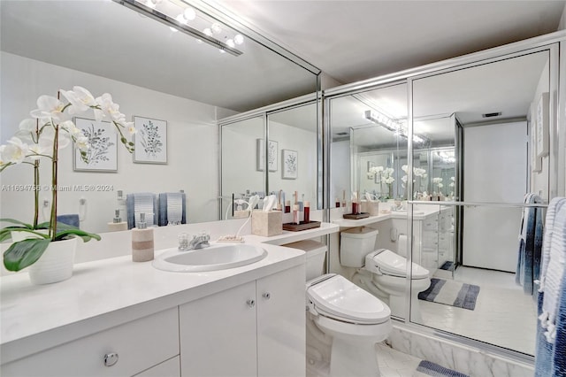 bathroom featuring vanity, toilet, and an enclosed shower