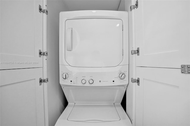 laundry room featuring stacked washer / dryer