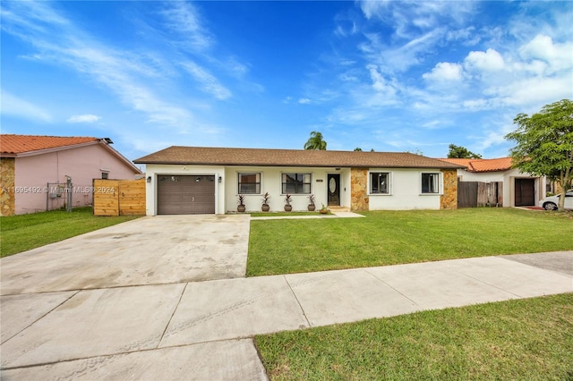 ranch-style house featuring a front yard and a garage