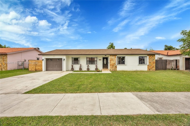 ranch-style house with a front yard and a garage