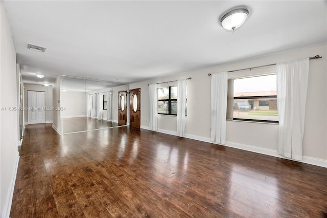 spare room with dark hardwood / wood-style floors