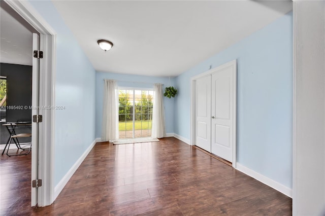 unfurnished bedroom featuring dark hardwood / wood-style flooring