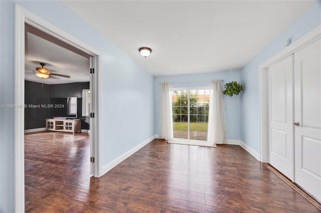 spare room with ceiling fan and dark hardwood / wood-style flooring