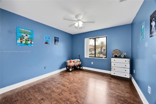 bedroom featuring ceiling fan and dark hardwood / wood-style floors